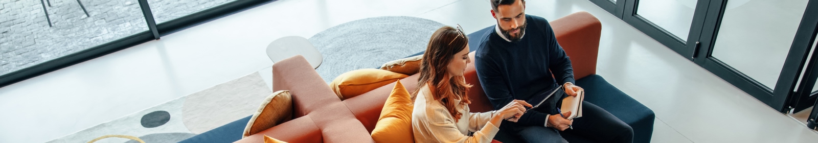 two business people looking at a tablet